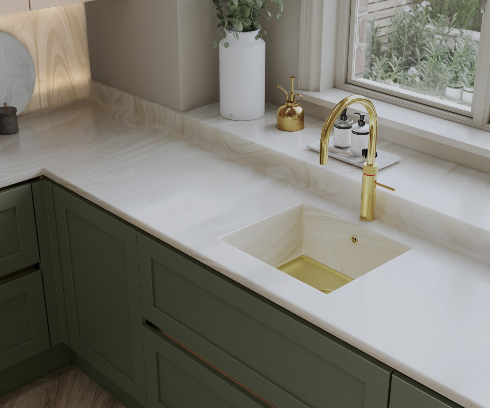 Overhead view of Integra Wardley in shade Misty Moors, with a white worktop and sink, paired with a brss kitchen tap.