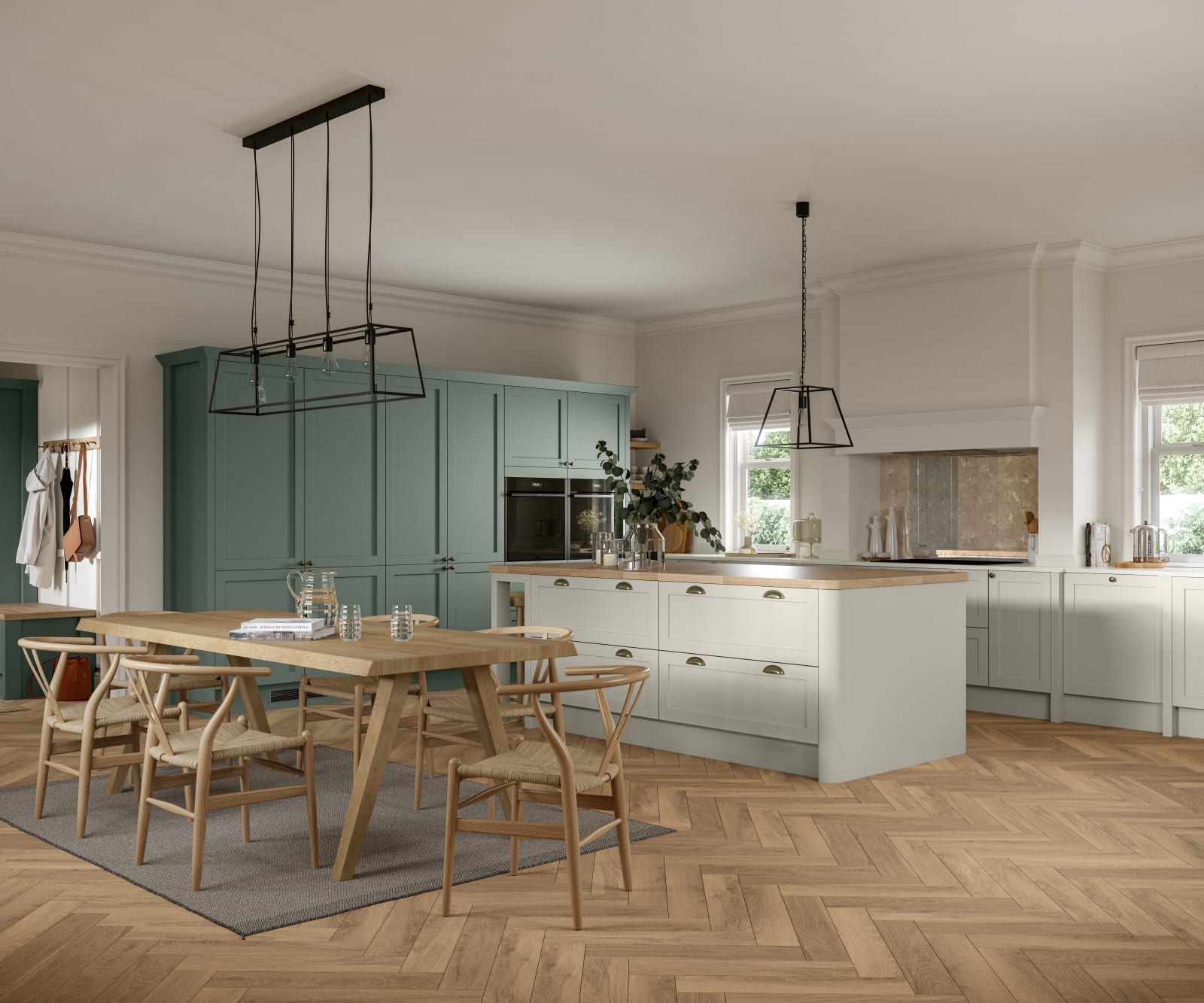 Ambleside Shaker kitchen in Moss and Limestone colours, featuring cup handles, and a spacious open-plan layout.