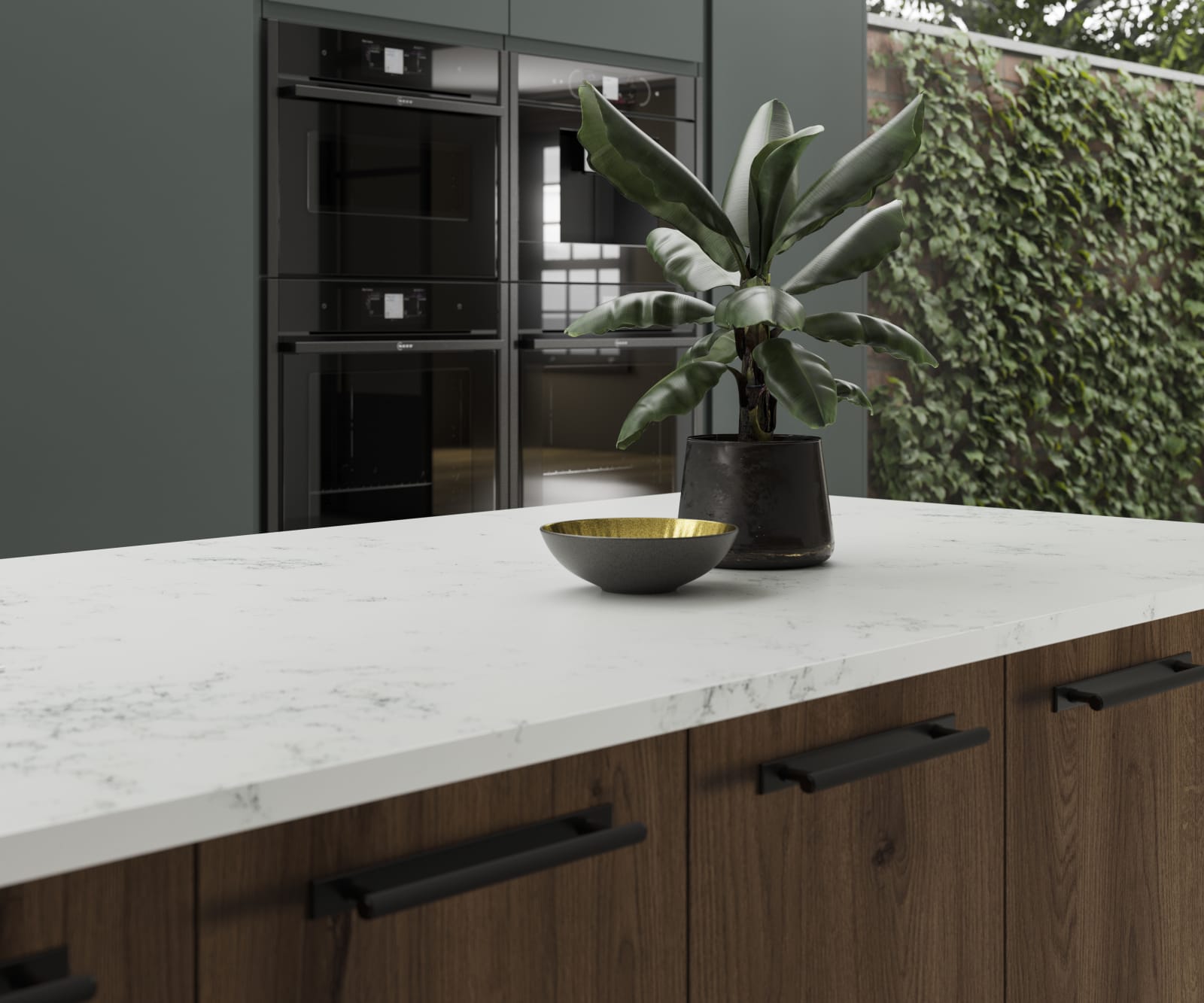 A kitchen island created using Portobello cabinets in Umbra, paired with a light worktop and decorated with botanical accents.