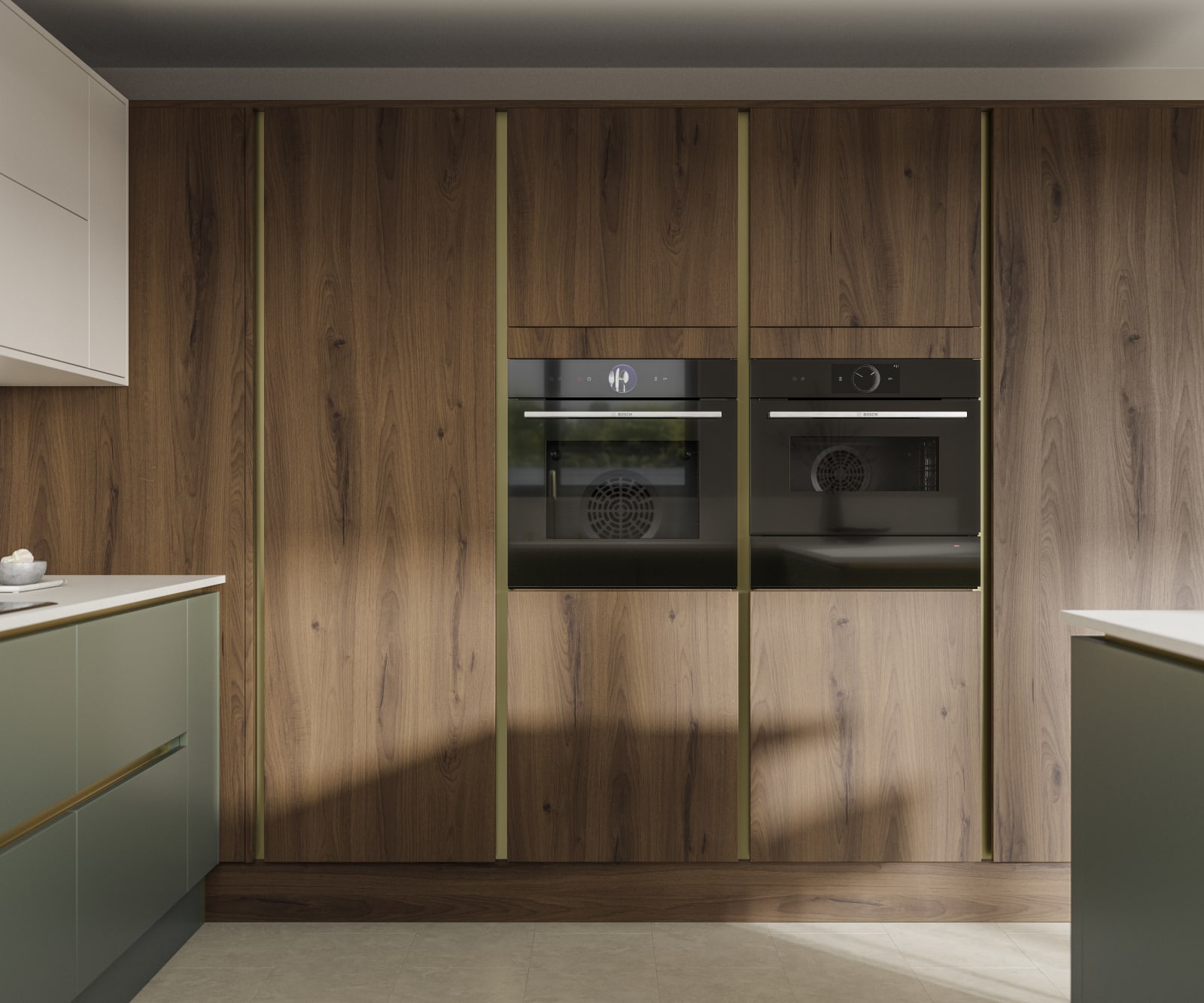 Integra Portobello tall cabinetry with integrated ovens, paired with painted handleless slab front Integra Soho in Shades Thyme and Limestone, from Magnet.