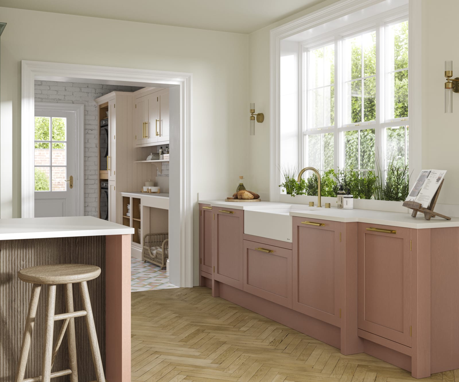 Wardley kitchen cabinetry in shades Clay and Thyme, as well as lighter beige shade Utility room visible through wide archway.