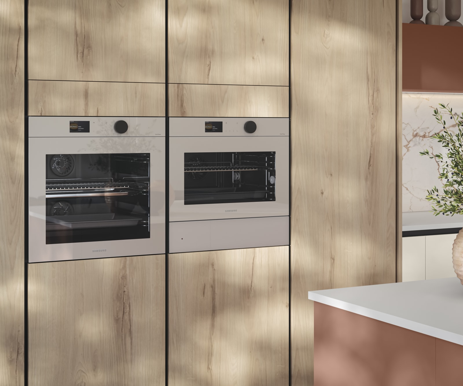 Tall Integra Portobello Bosco cabinetry, a contemporary handleless slab with with organic woodgrain texture, and integrated Samsung ovens.
