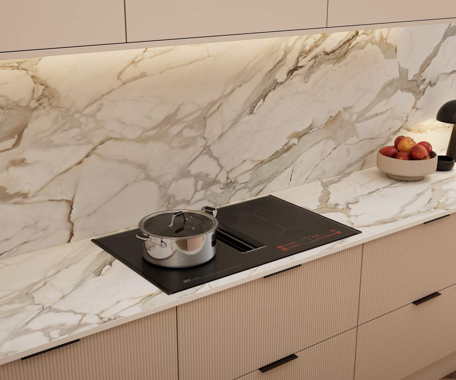 Fluted front kitchen Reed from Magnet in light warm neutral shade Shell, with a marbled splashback and worktop, induction hob and black handles