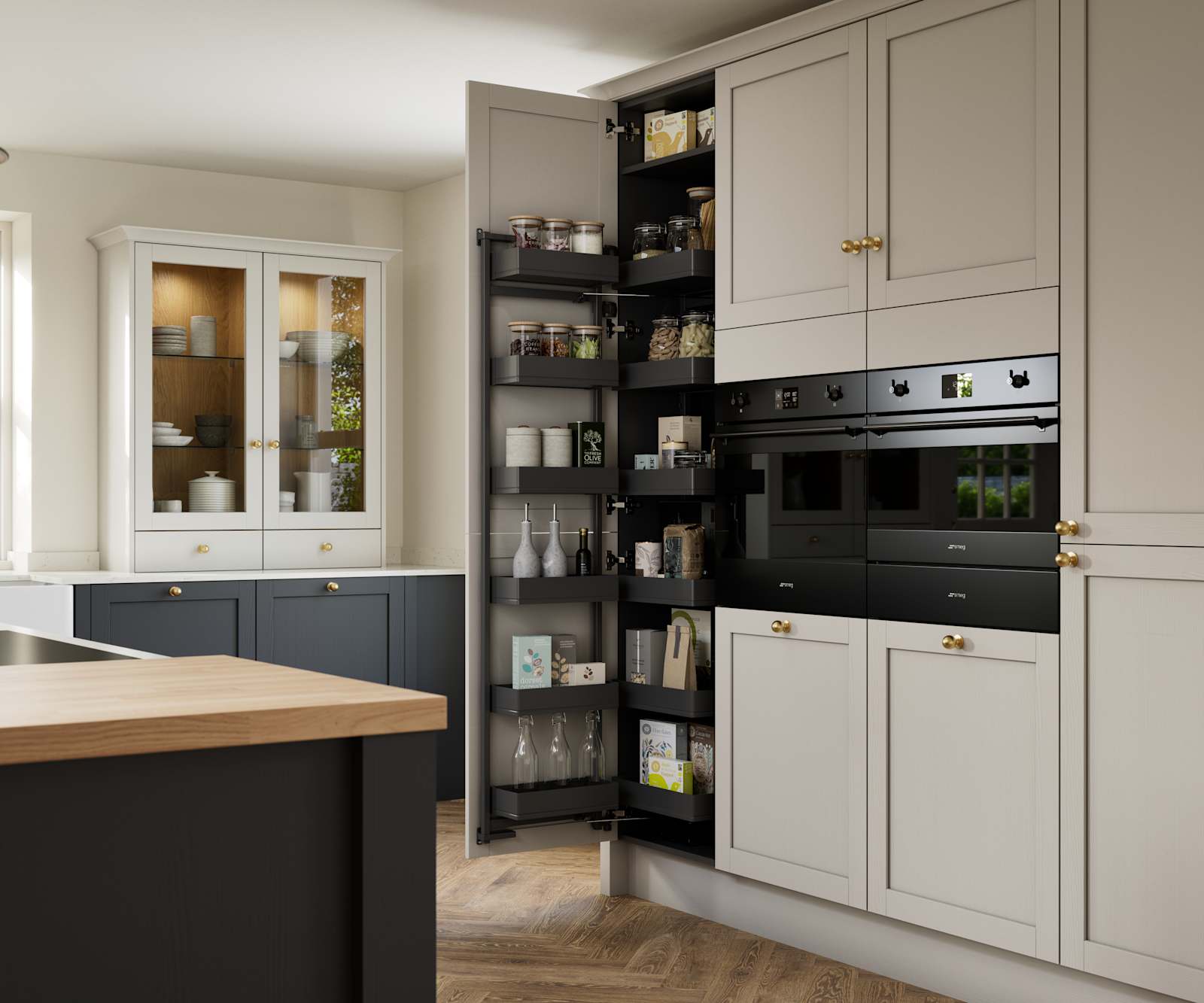 Contemporary Shaker kitchen island Ambleside from Magnet in deep blue shade Lake with beige tall cabinets, herringbone wood flooring and wood diningroom table