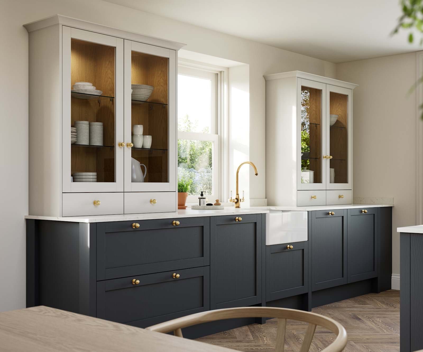 Contemporary Shaker kitchen Ambleside from Magnet in deep blue shade Lake with beige glass fronted dresser cabinets, belfast ceramic sink and brass knobs matching brass tap