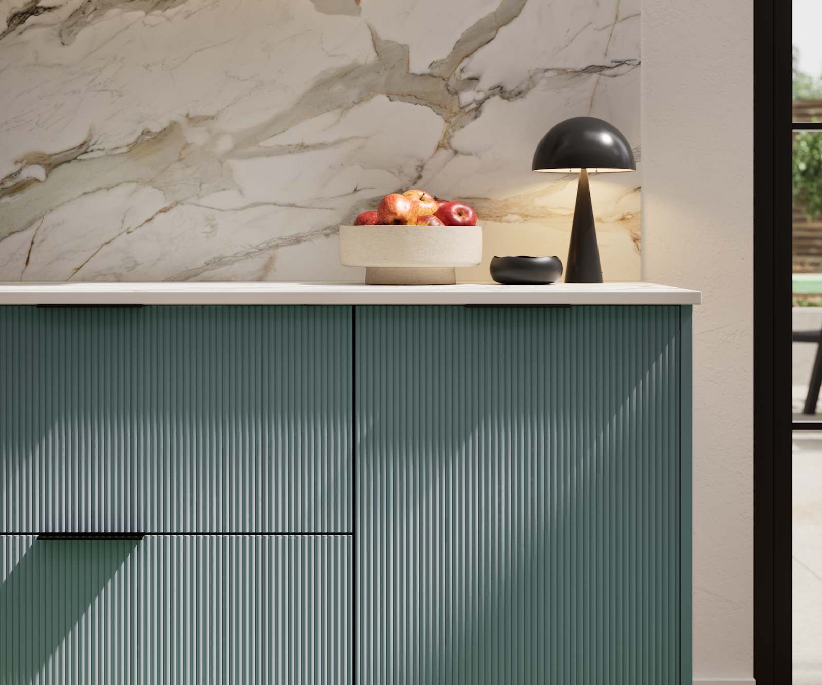 Fluted front kitchen Reed from Magnet in blue shade Morris Blue, with a marbled splashback and black handles, herringbone wood flooring.