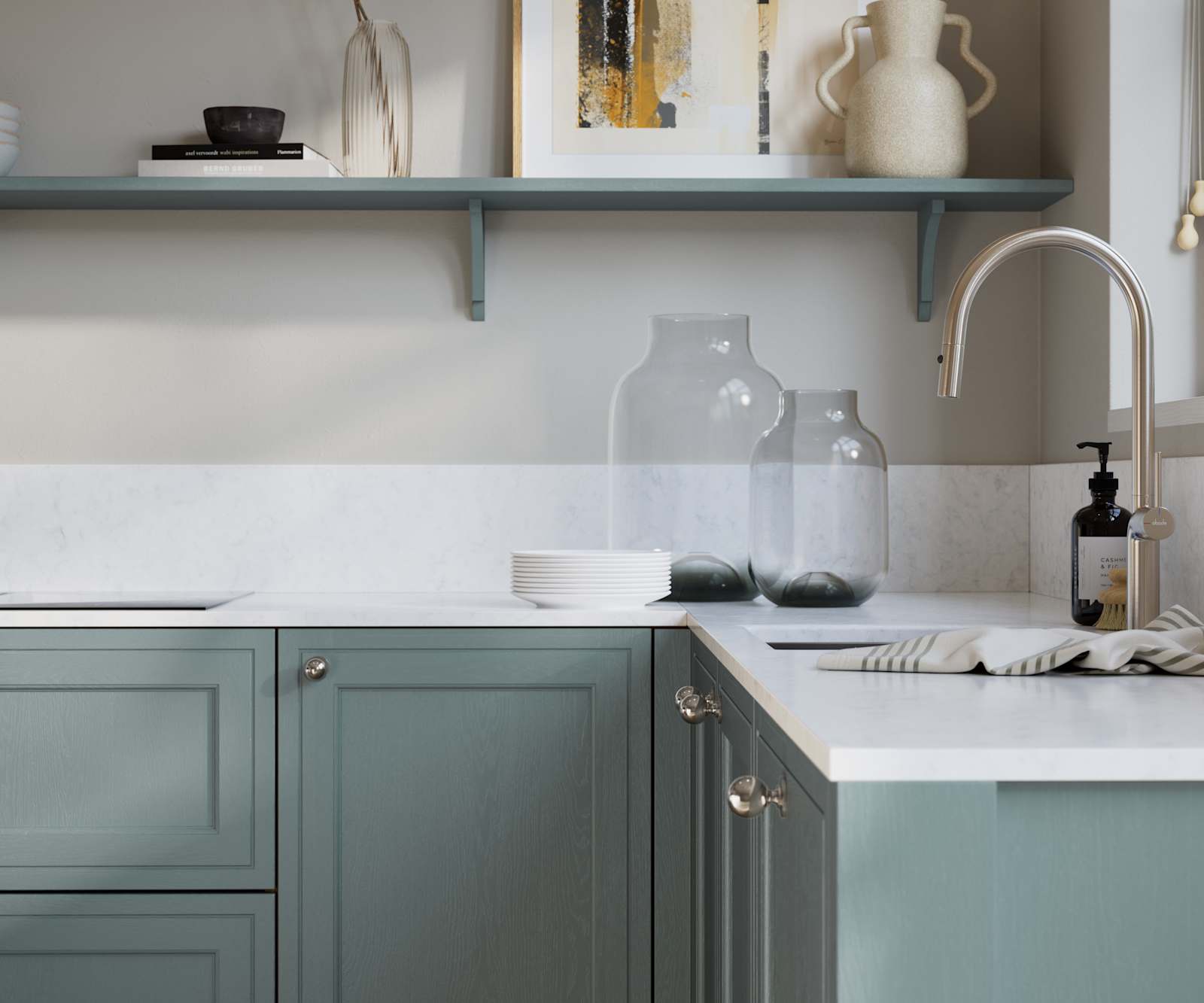 Bewdley Duck Egg painted wood grain Shaker kitchen cabinetry with steel knobs, steel tap, white marbled worktop and matching backsplash, an open shelf on the wall above cabinets with ceramics and a vase of flowers.