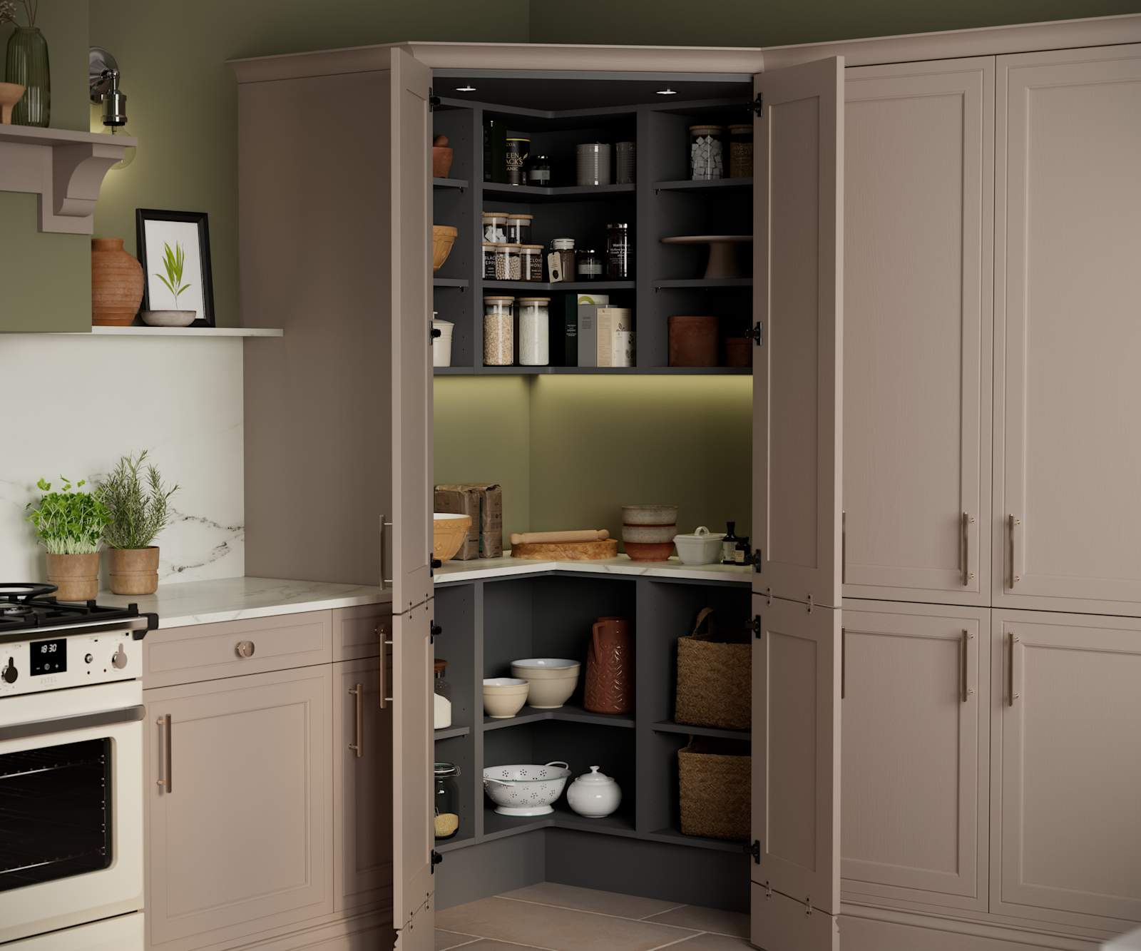 Opened walk-in pantry in Shaker style painted wood grain Bewdley kitchen in neutral shade Cornish Clay, tall cabinets with marbled worktop and matching backsplash and gas range cooker.
