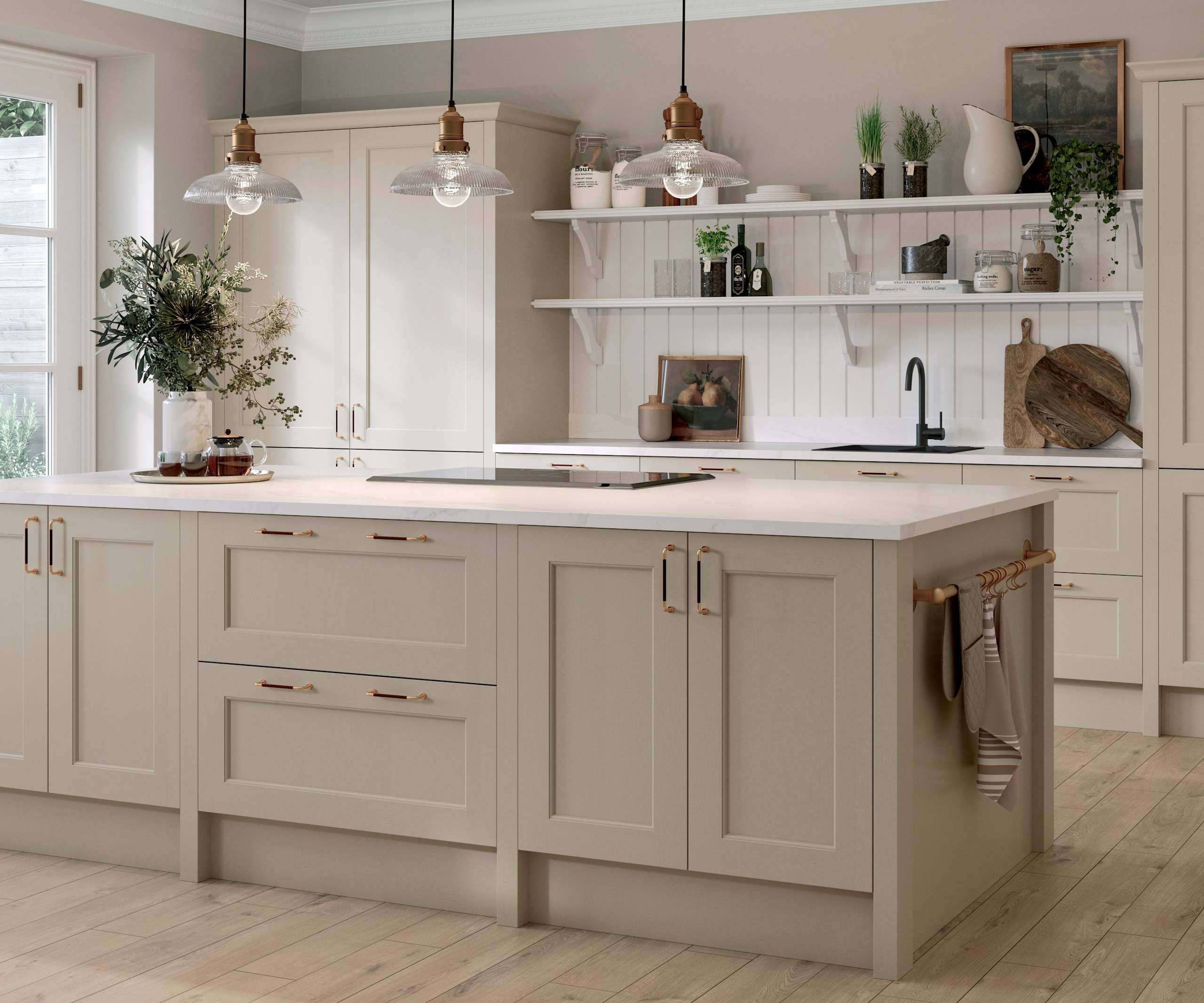 Ludlow Kitchen island and tall cabinets, a Shaker door with a modern country-style in the neutral shade Pebble path with a sleek light worktop and wooden floors.