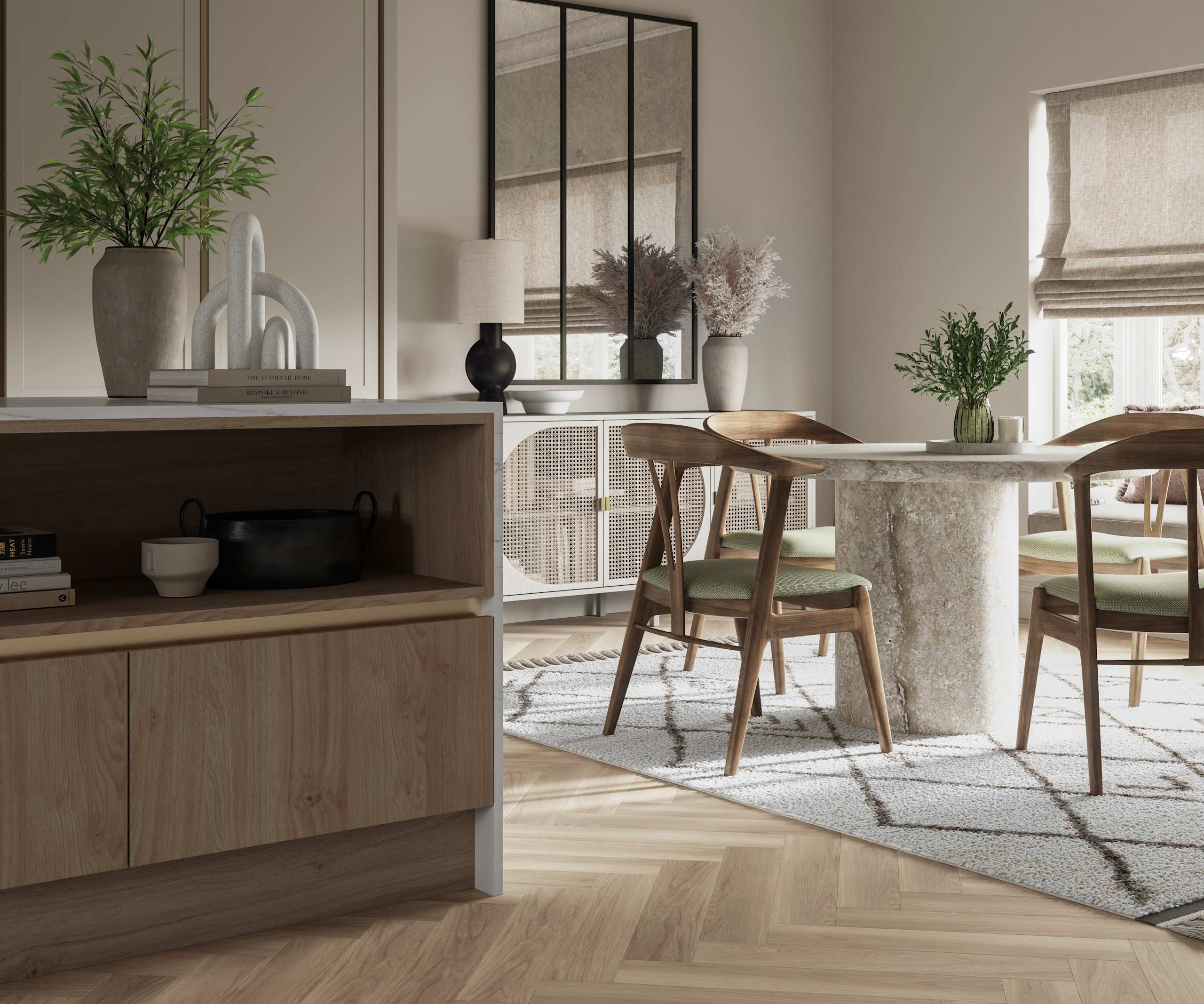Integra Ascoli kitchen, close-up view of kitchen island with dining table in background. Light and earthy toned interior with plants.
