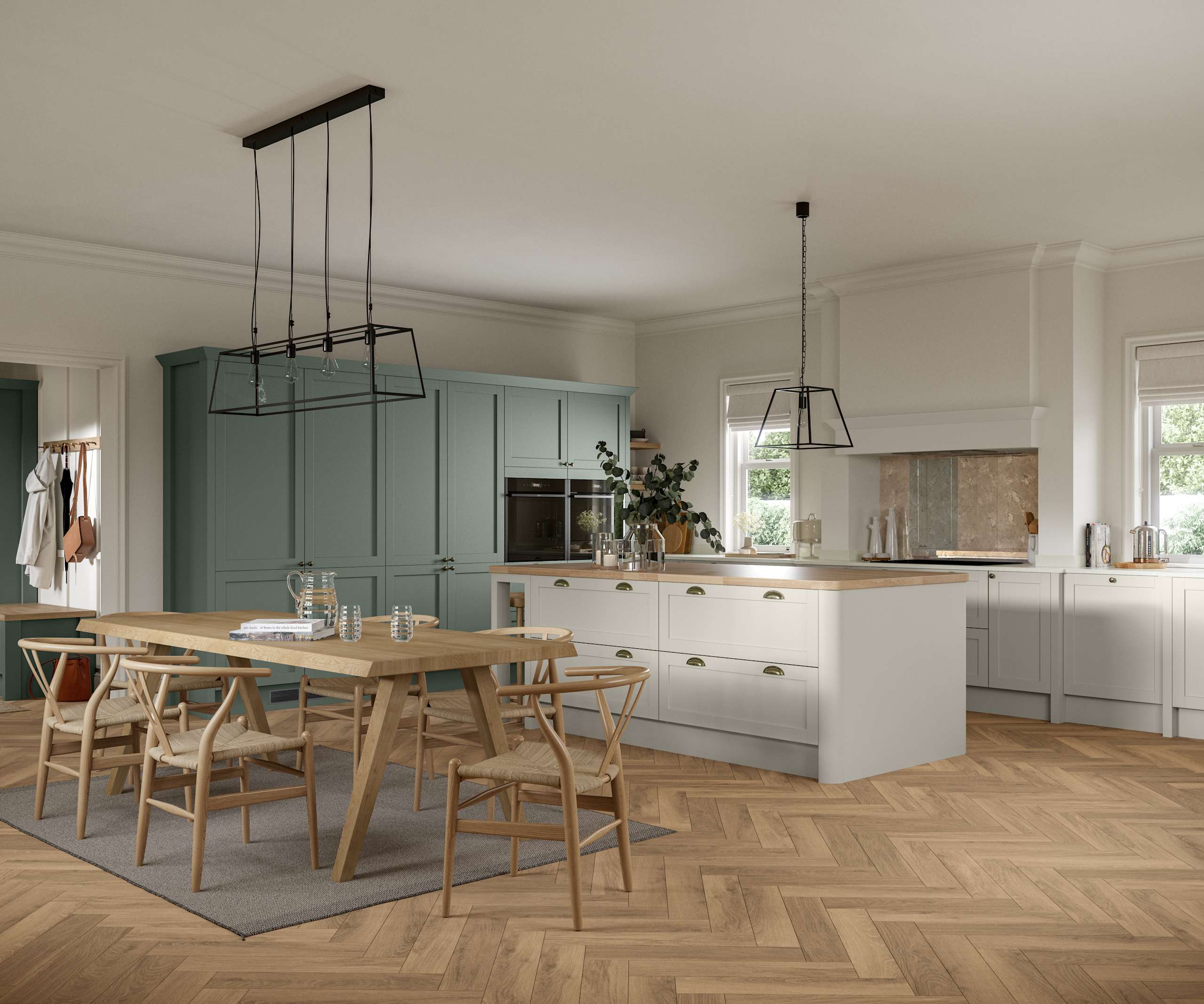 Ambleside Shaker kitchen in Moss and Limestone colours, featuring cup handles, and a spacious open-plan layout.