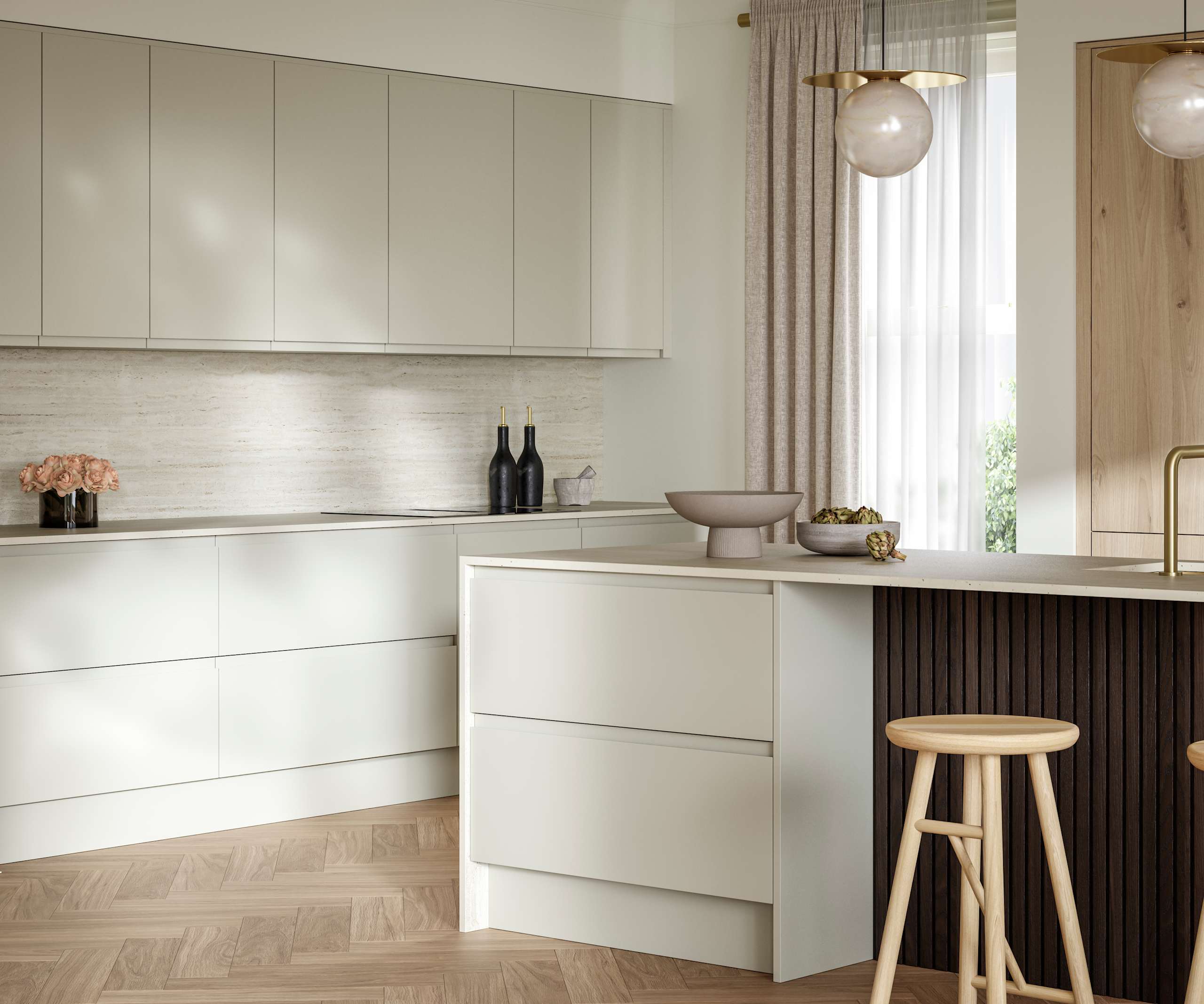 A bright and airy open-plan kitchen that incorporates Duxbury drawers and cabinets in Limestone, and Portobello units in Bosco. Combined with dark wood paneling on kitchen island bar.
