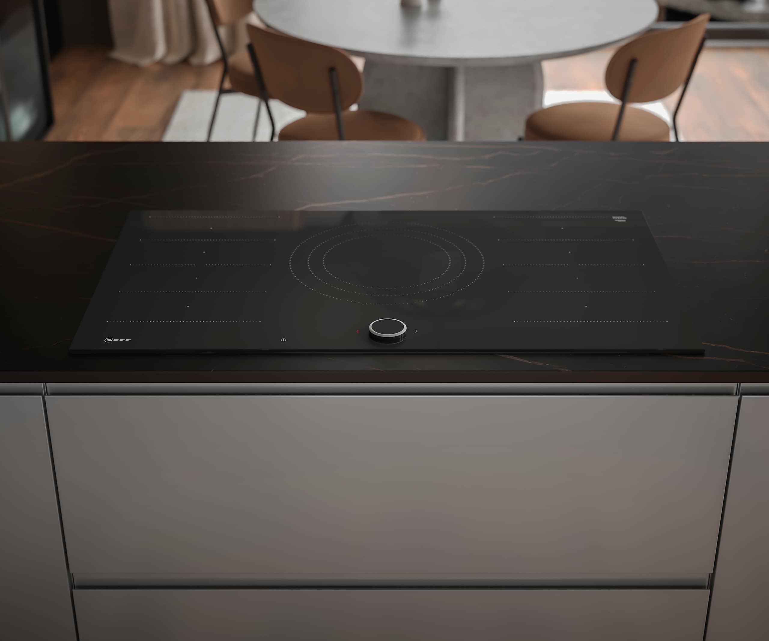 An overhead view of a sleek glass Neff hob, with modern Duxbury kitchen drawers that include an integrated J-pull handle.