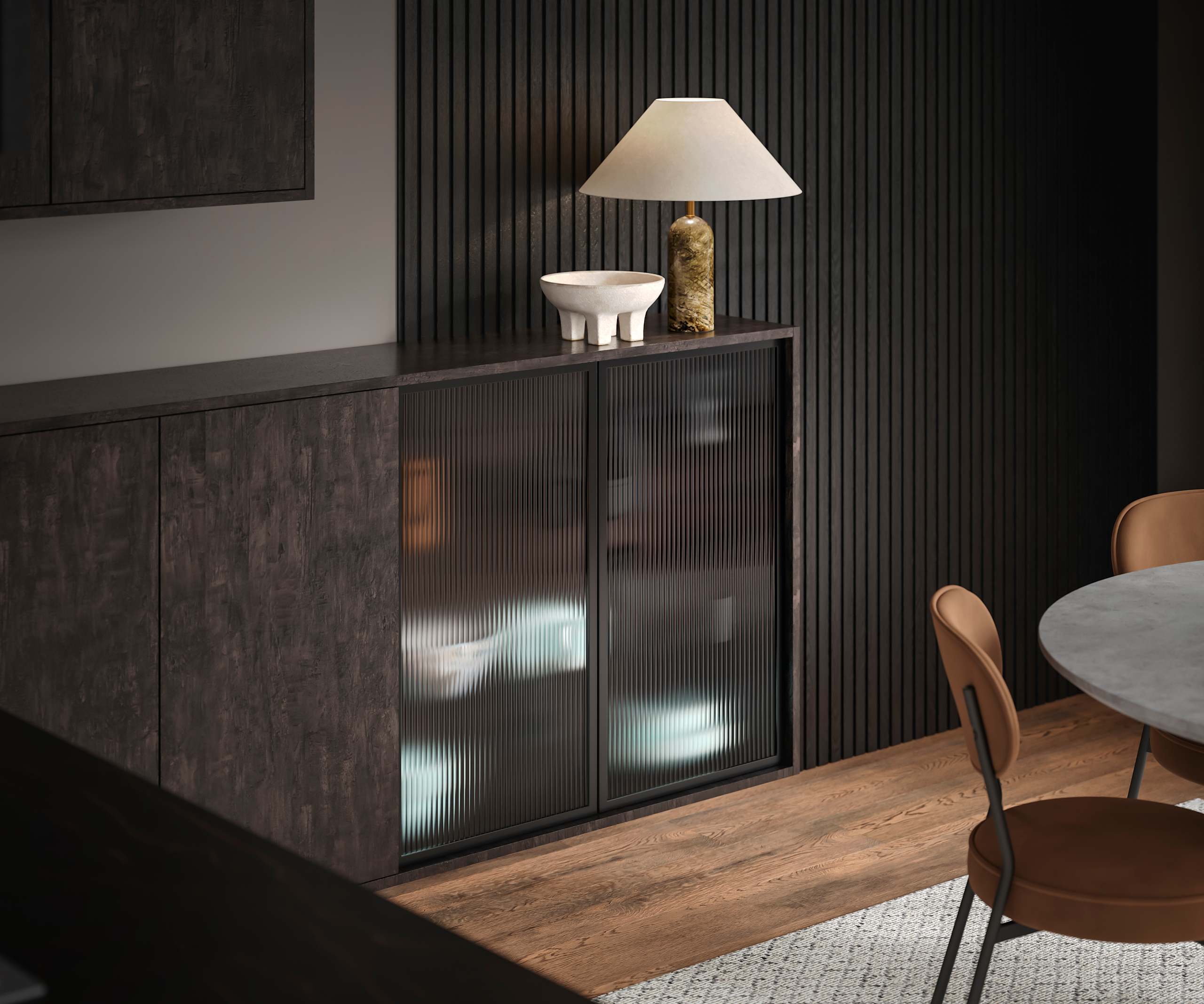Elegant fluted glass cabinets are offset against the organic woodgrain texture of Magnet's Portobello kitchen range in dark Etna.