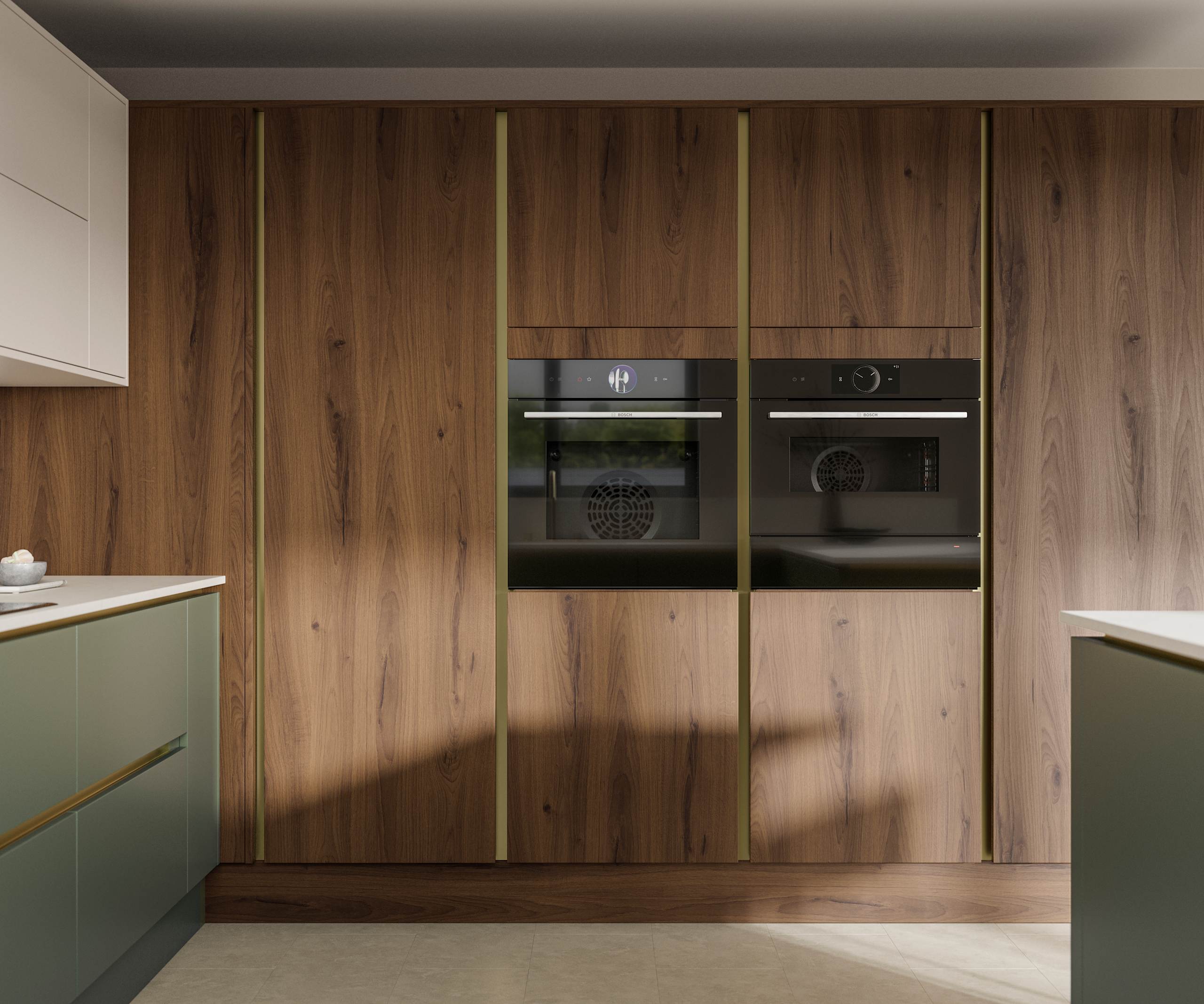 Integra Portobello tall cabinetry with integrated ovens, paired with painted handleless slab front Integra Soho in Shades Thyme and Limestone, from Magnet.
