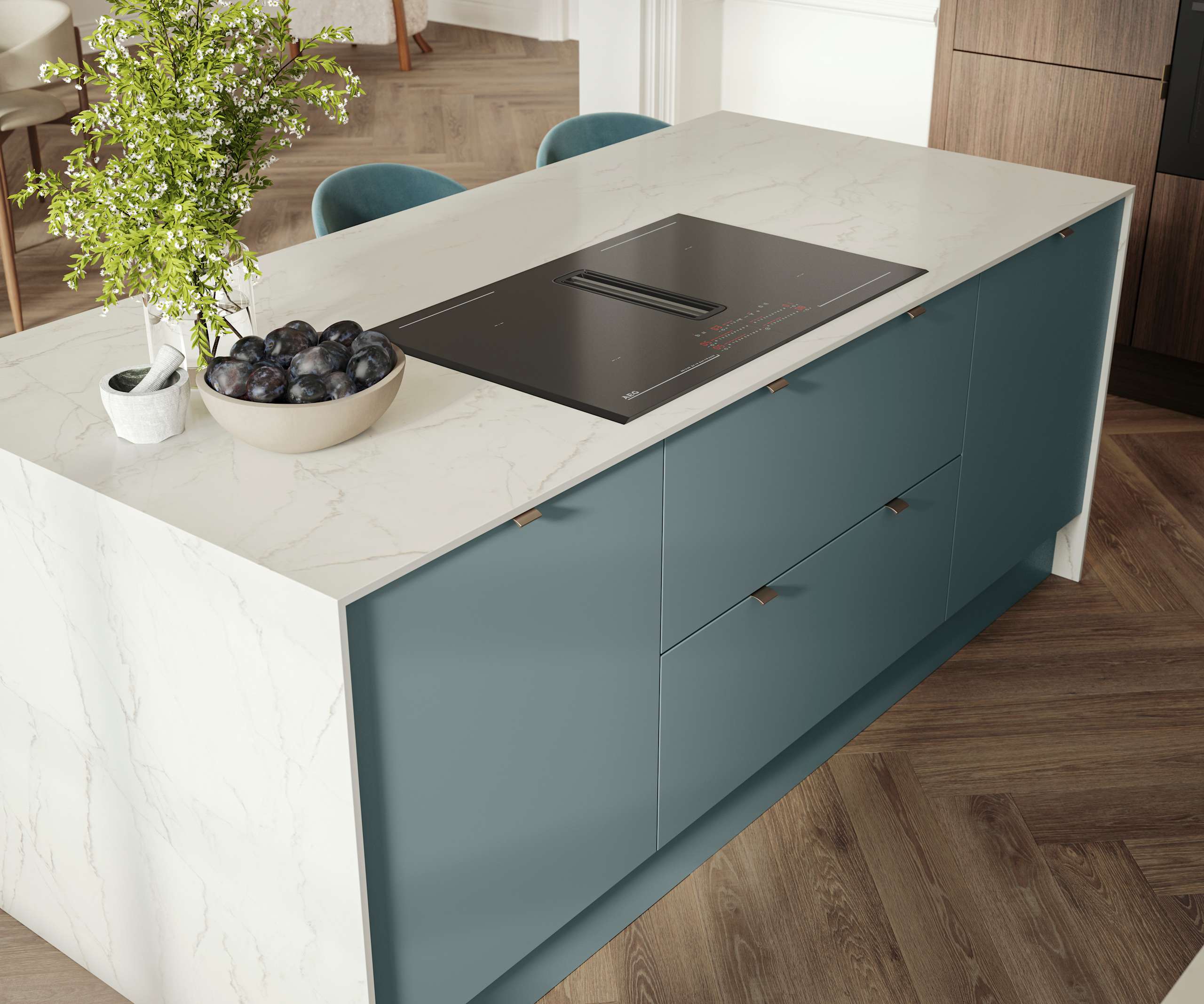 Overhead view of kitchen island with marbled dekton worktop, integrated hob and Soho Duck Blue cabinetry from Magnet.