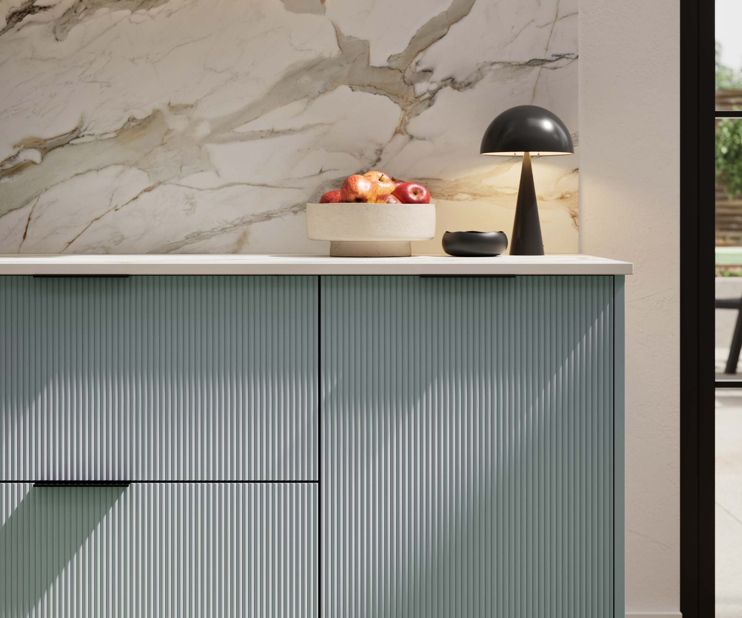 Fluted front kitchen Reed from Magnet in light blue shade Duck Egg, with a marbled splashback and black handles, herringbone wood flooring.