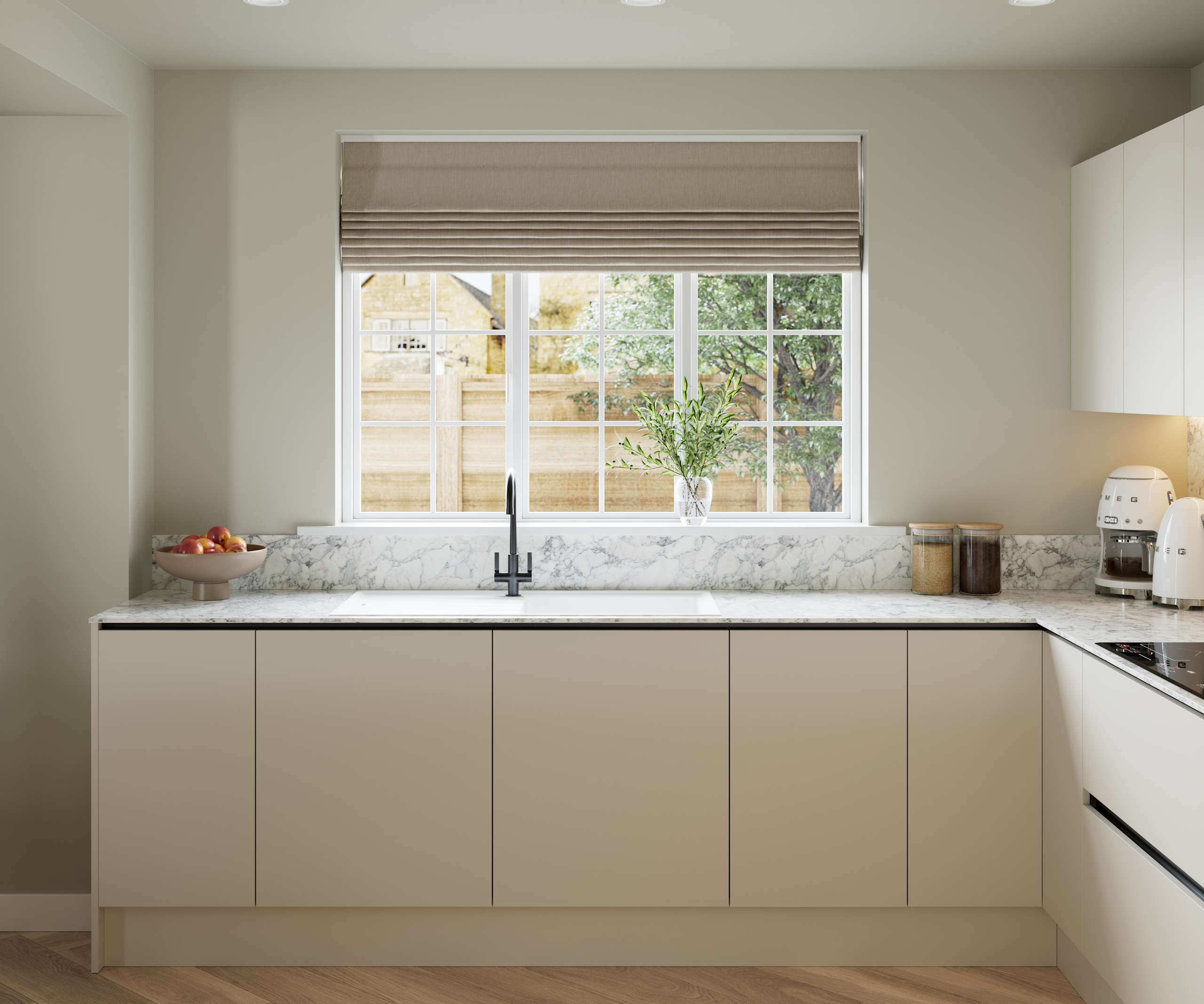 Open plan light neutral shade fluted kitchen with integrated appliances, white and grey marble worktop and upstand. Herringbone wood flooring.