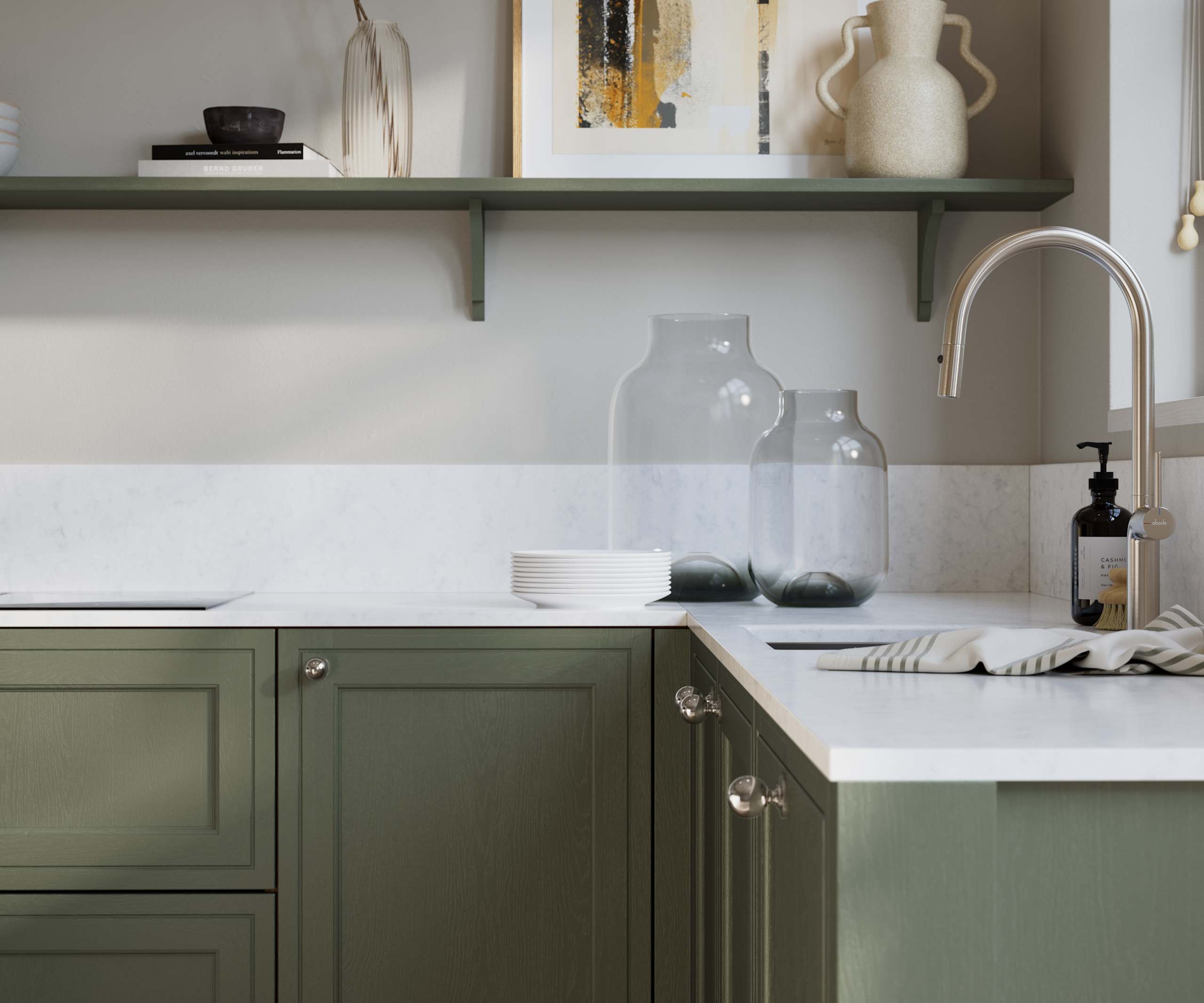 Bewdley Thyme painted wood grain Shaker kitchen cabinetry with steel knobs, steel tap, white marbled worktop and matching backsplash, an open shelf on the wall above cabinets with ceramics and a vase of flowers.