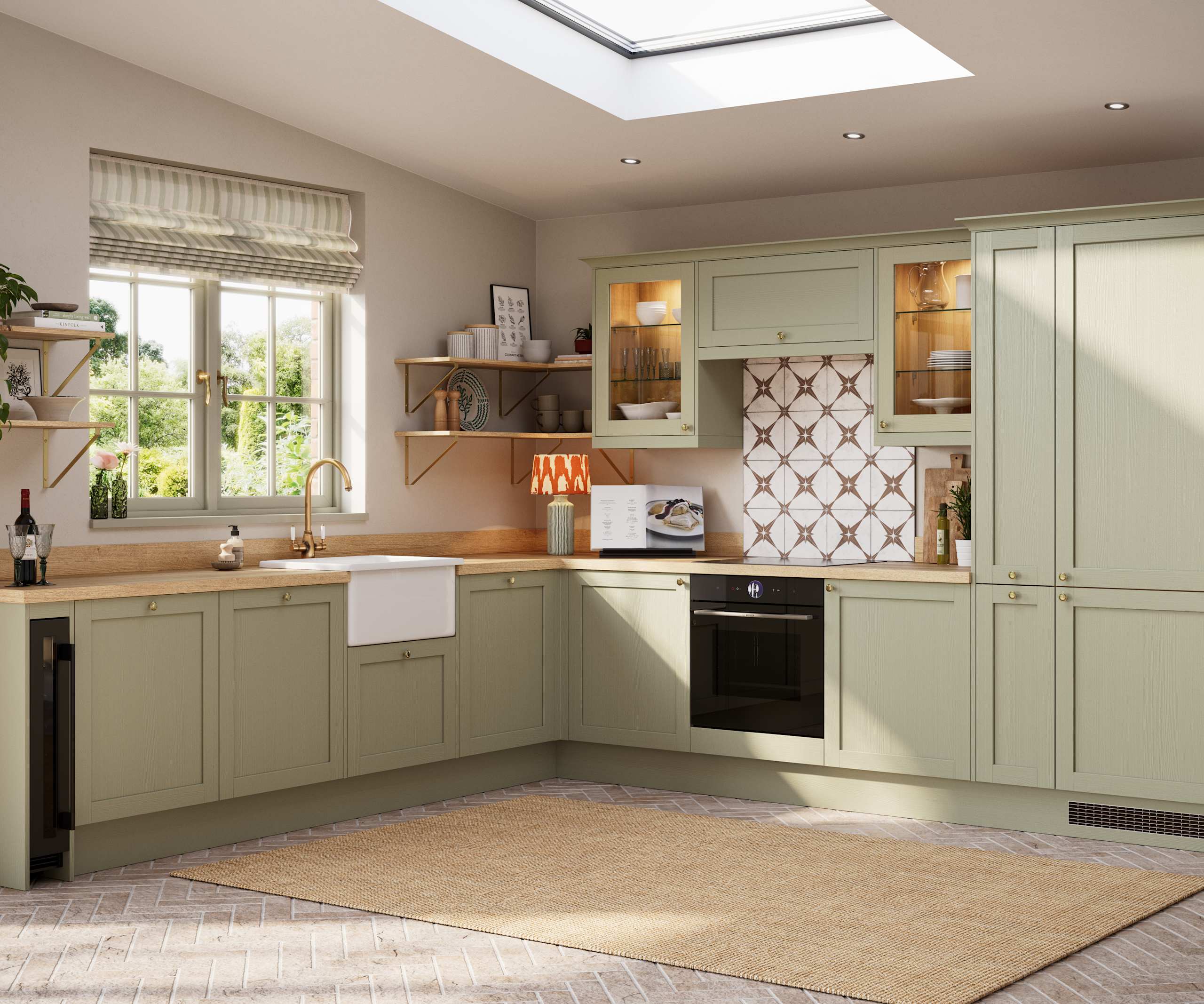 Contemporary Shaker kitchen Ambleside from Magnet in sage green shade Meadow with belfast sink, aged taps and wooden effect worktop.
