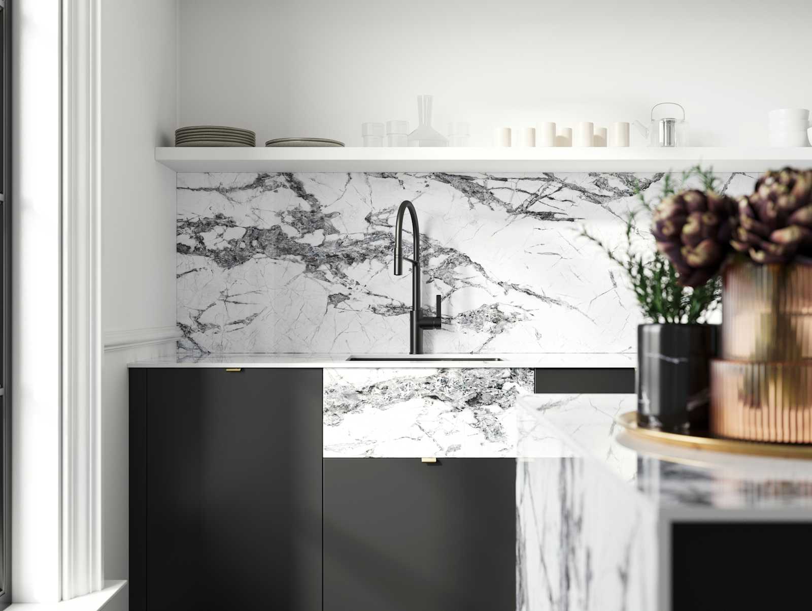 Minimal maximalism with Magnet's Hoxton kitchen in Sumi Black, combined with fake belfast sink using with white marbled worktop and splashbacks.