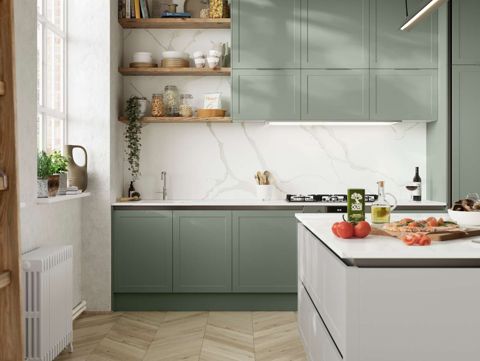 Integra Dunham from Magnet is a handleless shaker frontal, here shown in kitchen with kitchen island and wall cabinets in shades Eucalyptus and Washed Cotton, with a white marbled worktop and matching splashback with wood open wall shelves..