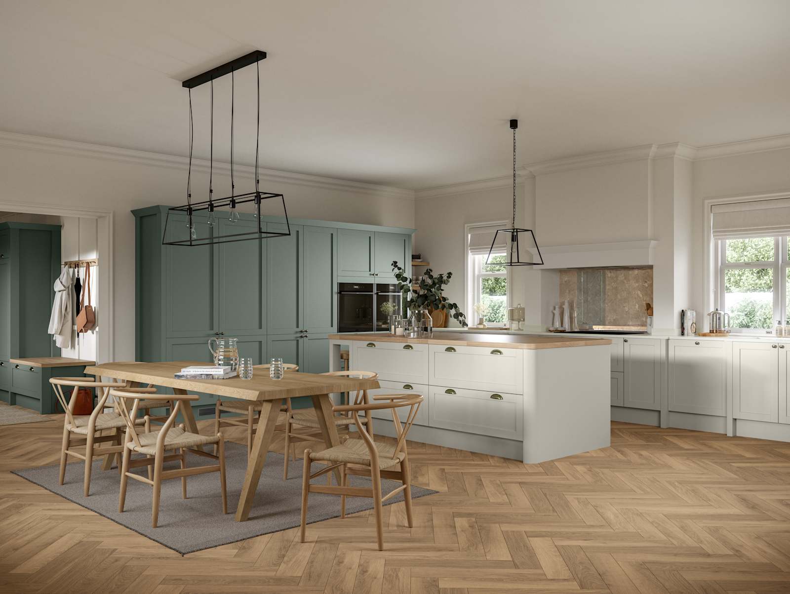 Ambleside Shaker kitchen in Moss and Limestone colours, featuring cup handles, and a spacious open-plan layout.