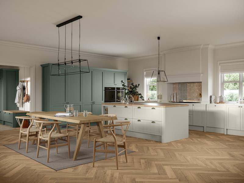 Ambleside Shaker kitchen in Moss and Limestone colours, featuring cup handles, and a spacious open-plan layout.