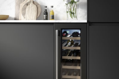 Luna Kitchen from Magnet. An affordable handless black kitchen with integrated J Pull doors for a stylish and modern look.