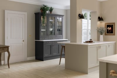 Ludlow kitchen, a Shaker door with a modern country-style in the neutral shade Pebble path paired with dark grey tall glass door display cabinets.