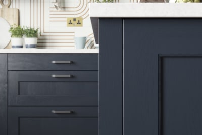 Close-up of modern country-style Shaker door Ludlow in dark blue shade Midnight.