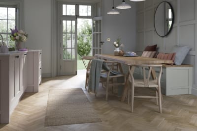 Ludlow, a traditional Shaker-style kitchen range featuring panelled doors with visible woodgrain and beading detail, in the light airy shade Seagrass.