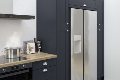 Tatton Midnight kitchen from Magnet, a contemporary dark blue narrow frame shaker door paired with a wood worktop and steel handles.