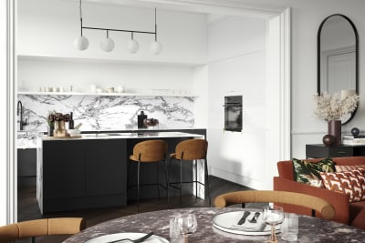 Minimal maximalism with Magnet's Hoxton kitchen in Sumi Black, combined with white marbled worktop and splashbacks and colourful interiors.