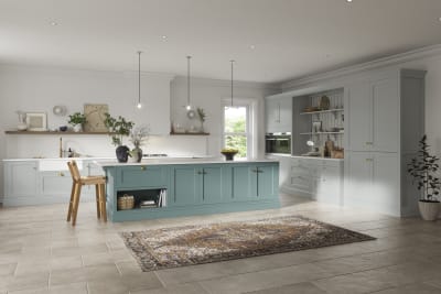 Traditional Shaker-style kitchen range in light grey with a blue kitchen island.