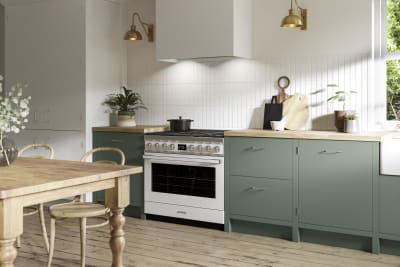 Soho Eucalyptus Green kitchen in charming contemporary cottage, a modern slab door with a painted rather than foil surface, for a truly premium look.