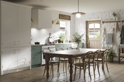 Contemporary cottage kitchen with Soho Eucaluptys, tall pantry cabinets in white, and a light wood dining table