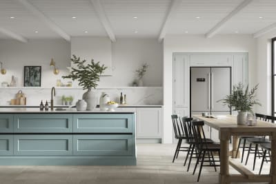 Integra Ludlow in shades Washed cotton and Morris Blue, a contemporary take on a Shaker kitchen, where the premium frontal features panelled doors with integrated handles.