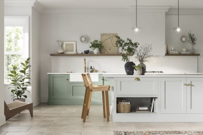 Traditional Shaker-style kitchen range in Eucalyptus Green with a light grey Fresh Linen shade kitchen island.