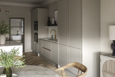 Integra Dunham Pebble path tall cabinets in neutral kitchen decorated with plants and brass tap