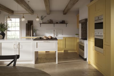 Open floorplan shaker kitchen in the bright and beautiful yellow shade Harvest, paired with a kitchen island with matching frame door cabinets in white.