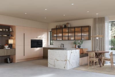 Full room view of open plan kitchen Soho Chalk Blush, matched with fluted glass display cabinets and oak front cabinetry in Nordic Nature.