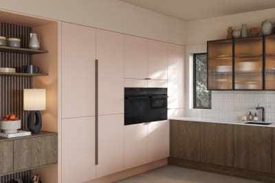 Soho cabinets in shade Chalk Blush, matched with fluted glass display cabinets and oak front cabinetry in Nordic Nature.