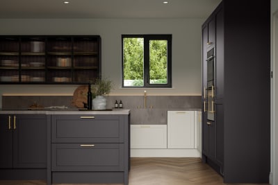 A Shaker kitchen in a contemporary kitchen, showing a mix of cabinet colours including Graphite and Limestone.