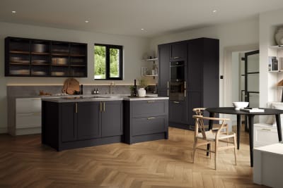 A contemporary Shaker kitchen with black cabinets and hardwood floors, paired with fluted glass cabinets.