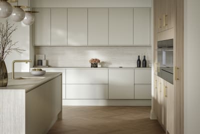 A bright and airy open-plan kitchen that incorporates Duxbury drawers and cabinets in Limestone, and Portobello units in Bosco.