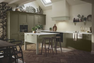 Wardley Arboretum cabinets paired with brass handles and kitchen tap makes an an elegant, contemporary Shaker kitchen, with a lighter shade kitchen island.