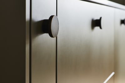 Close-up of Soho Balmoral cabinets with black circle handles