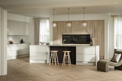 A wide view of a modern open plan kitchen, featuring a breakfast bar within a kitchen island, and full height Portobello woodgrain cabinets.