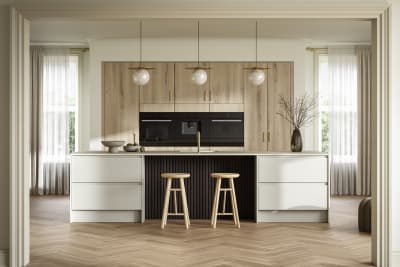 Portobello kitchen cabinets in a light woodgrain are set behind Magnet's Duxbury range in Limestone, creating a light and modern open plan kitchen with a breakfast bar island.